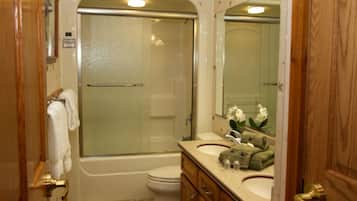 Combined shower/bathtub, hair dryer, towels, soap