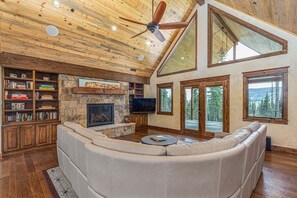 TV, fireplace, books, video library - Grand Estate Nestled in Forest, Private Pond, Waterfall, Close to Ski, Hot Tub (Durango)