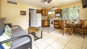 A compact living space with a kitchenette, a dining area, and a small seating area. - Cococabana6 newly renovated 1BR/1BA apar in downtown Coco, 5 min walk to beach. (Playas del Coco)