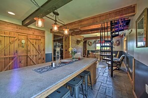 A rustic interior with a long wooden bar, stone flooring, and wooden beams. - Country Escape w/ Sauna, 10 Mi to Cooperstown (Richfield Springs)