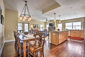 Enjoy cooking in this well-equipped kitchen with a central island, dining table, and ample counter space.