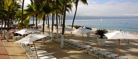 On the beach, free beach cabanas, sun loungers, beach umbrellas