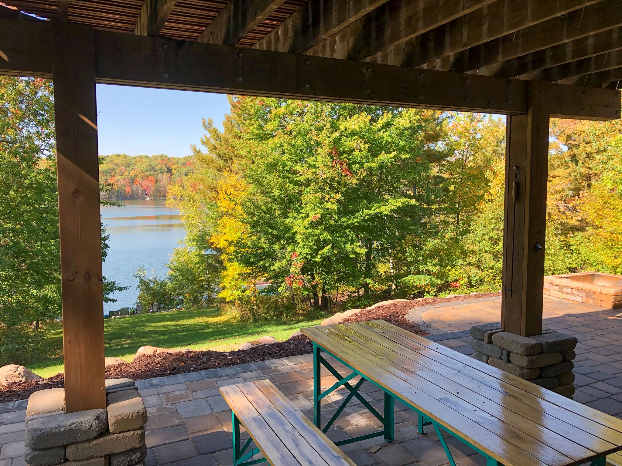 Another outdoor dining option off of the ground floor bar. Firepit in background
