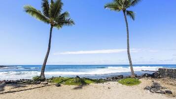 On the beach, sun loungers, beach towels