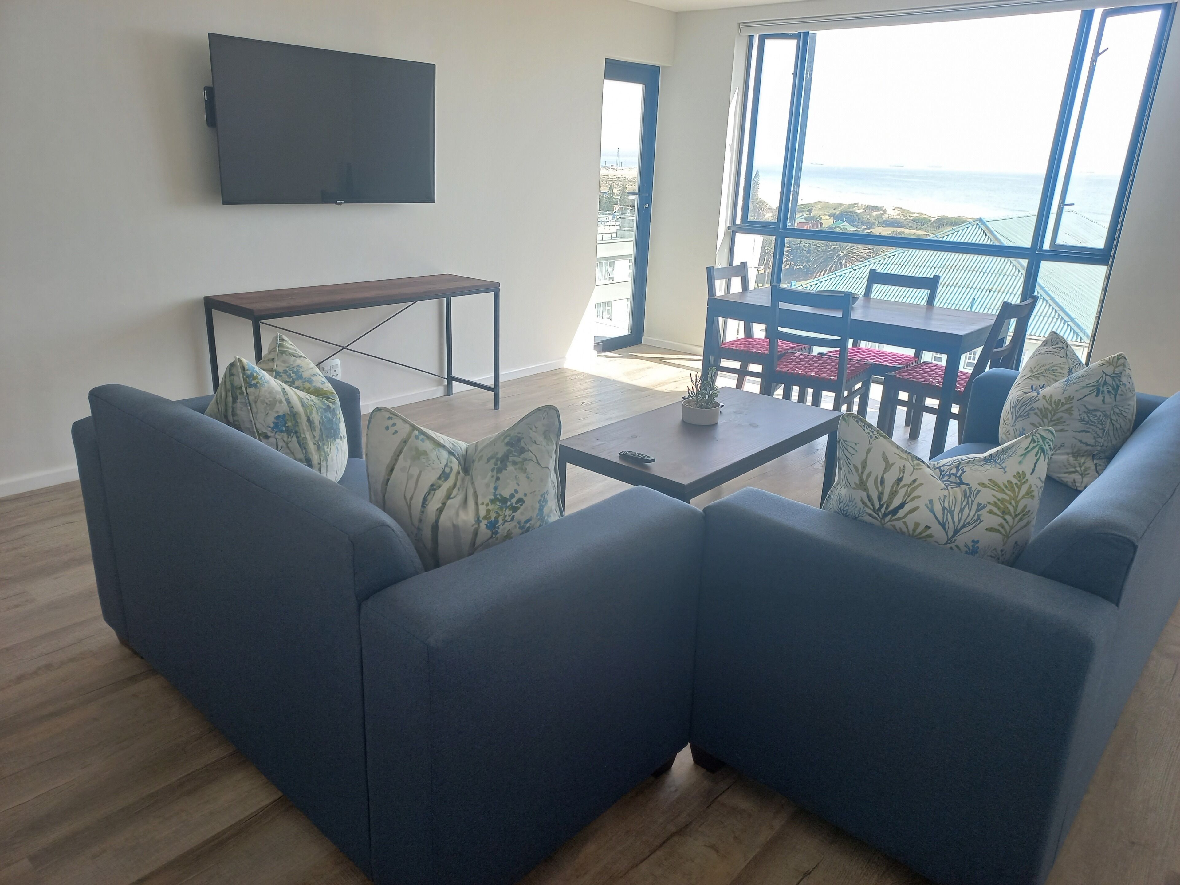 Executive Apartment, Sea View | Living area | 43-inch LCD TV with satellite channels, TV, fireplace