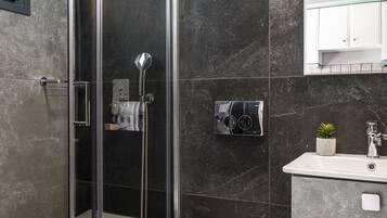 Shower, hydromassage showerhead, hair dryer, towels