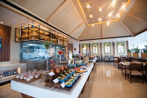 Enjoy meals in a spacious dining area with a long counter offering a variety of food and drink options.