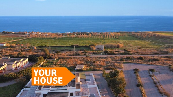 Aerial view - House on the sandy beach of the "Salento Maldives" (Salve)