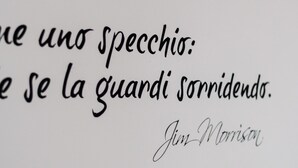 A quote in cursive handwriting on a white background. - It is a newly renovated attic located in a building from the early 1900s (Milano)