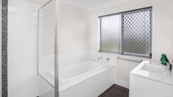 Bathtub, hair dryer, towels