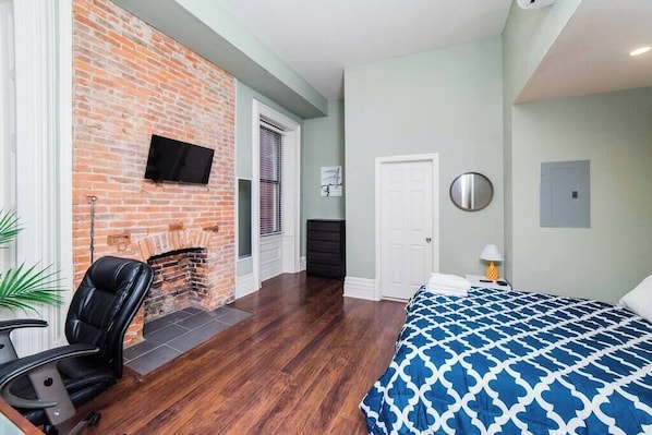 1 bedroom, desk, iron/ironing board, travel crib