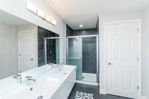 Shower, hair dryer, towels, shampoo