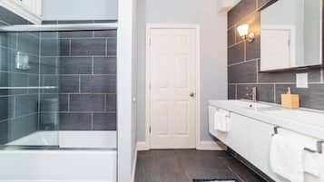 Shower, hair dryer, towels, shampoo