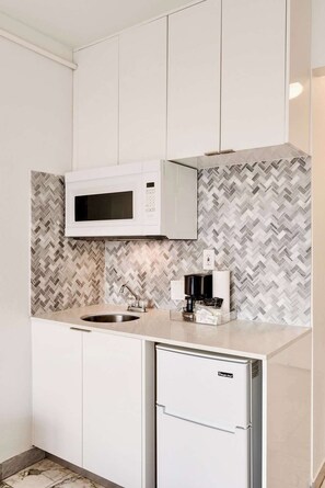 Fridge, microwave, coffee/tea maker, toaster