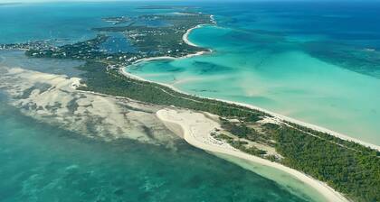 Pink Bikini Island Cottage with a dock on Black Sound