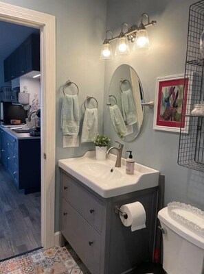 Shower, hair dryer, towels, soap