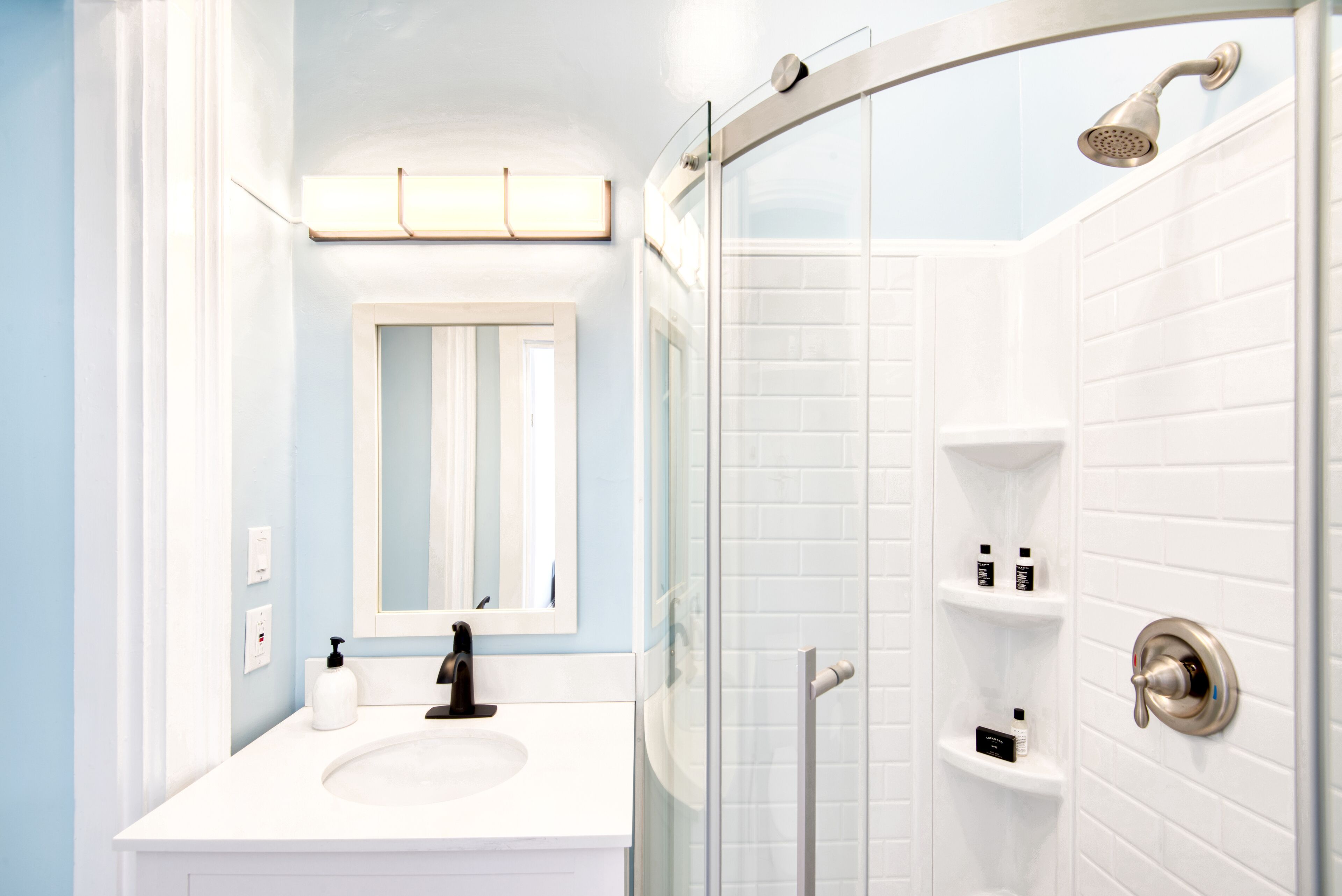 deluxe 2 bedroom suite 2 | bathroom | hair dryer, soap, shampoo, toilet paper