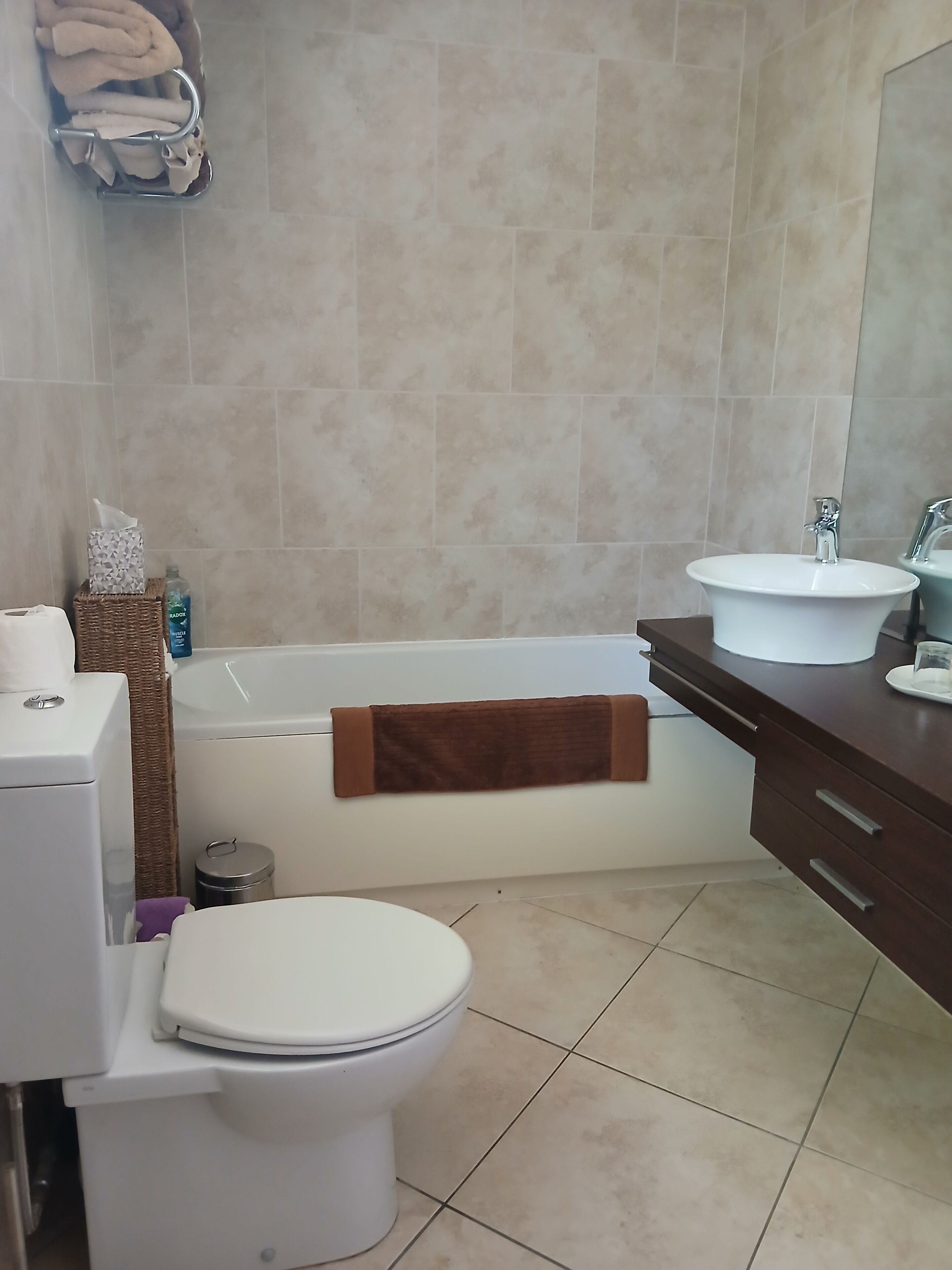 Bathtub, hair dryer, towels, soap