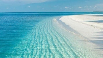 On the beach, sun loungers