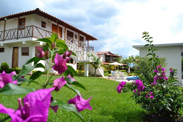 Traditional two-story home with a balcony and outdoor space.