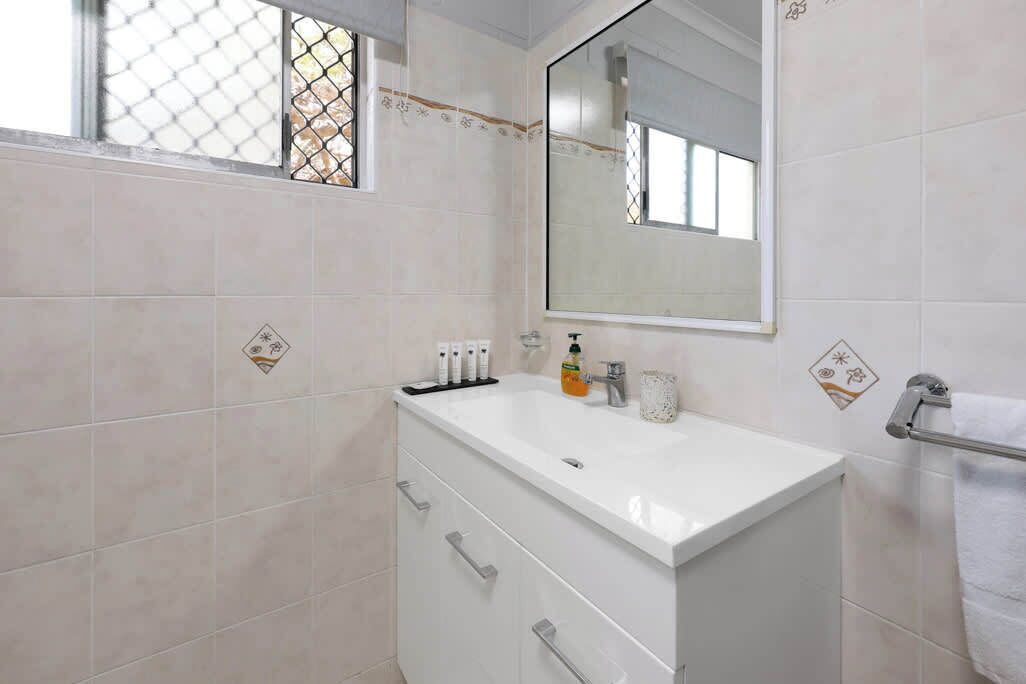 The bathroom includes a well-lit mirror over the vanity, perfect for your daily routine. We also provide hotel-style complimentary toiletries, adding a touch of luxury to make your stay even more comfortable and enjoyable.