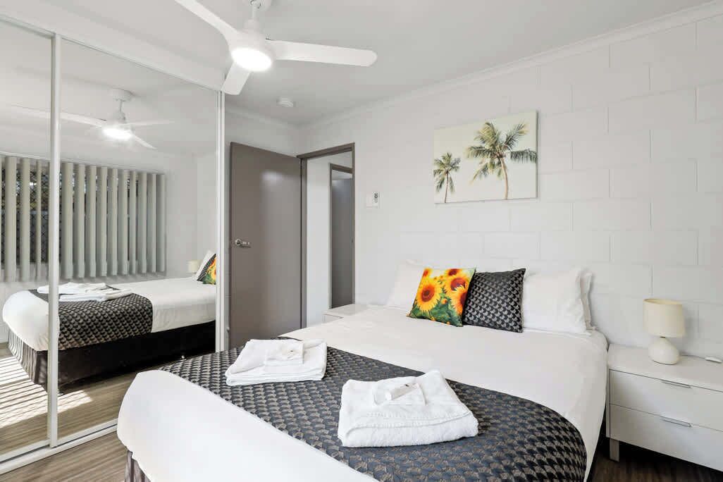 The second bedroom offers a comfortable queen-sized bed, thoughtfully chosen for a great night's sleep. A pillow menu ensures extra comfort, and the built-in wardrobe provides plenty of space for all your belongings.