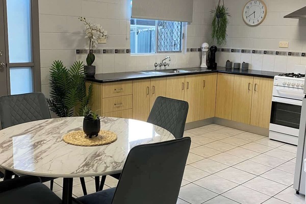 Gather around the table for a long breakfast or a proper home cooked dinner. The kitchen sits right alongside, so whoever is cooking never misses the conversation.