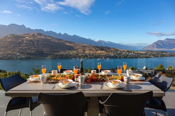 Scenic Outdoor Balcony with BBQ and Relaxation Areas – Unwind on this spacious balcony featuring comfortable seating, a BBQ, and stunning views, perfect for alfresco dining and relaxation in the fresh air.