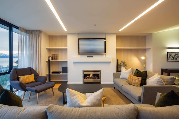 Cozy and warm ambiance with a fireplace at our luxury accommodation, Queenstown