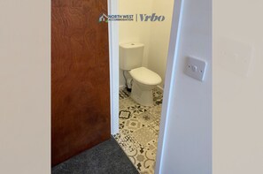 Bathtub, hair dryer, towels, soap