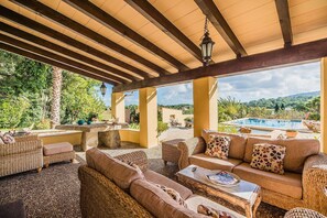 An outdoor patio with wicker furniture, a pool, and a view of the landscape. - Beautiful Villa "Enrique" with Mountain View, Pool, Wi-Fi, Garden & Terrace (POLLENÇA)