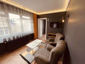 Economy Room, 1 King Bed | Living area | 82-inch LED TV with satellite channels, TV - OTTO CITY Premium Suites (Ankara)