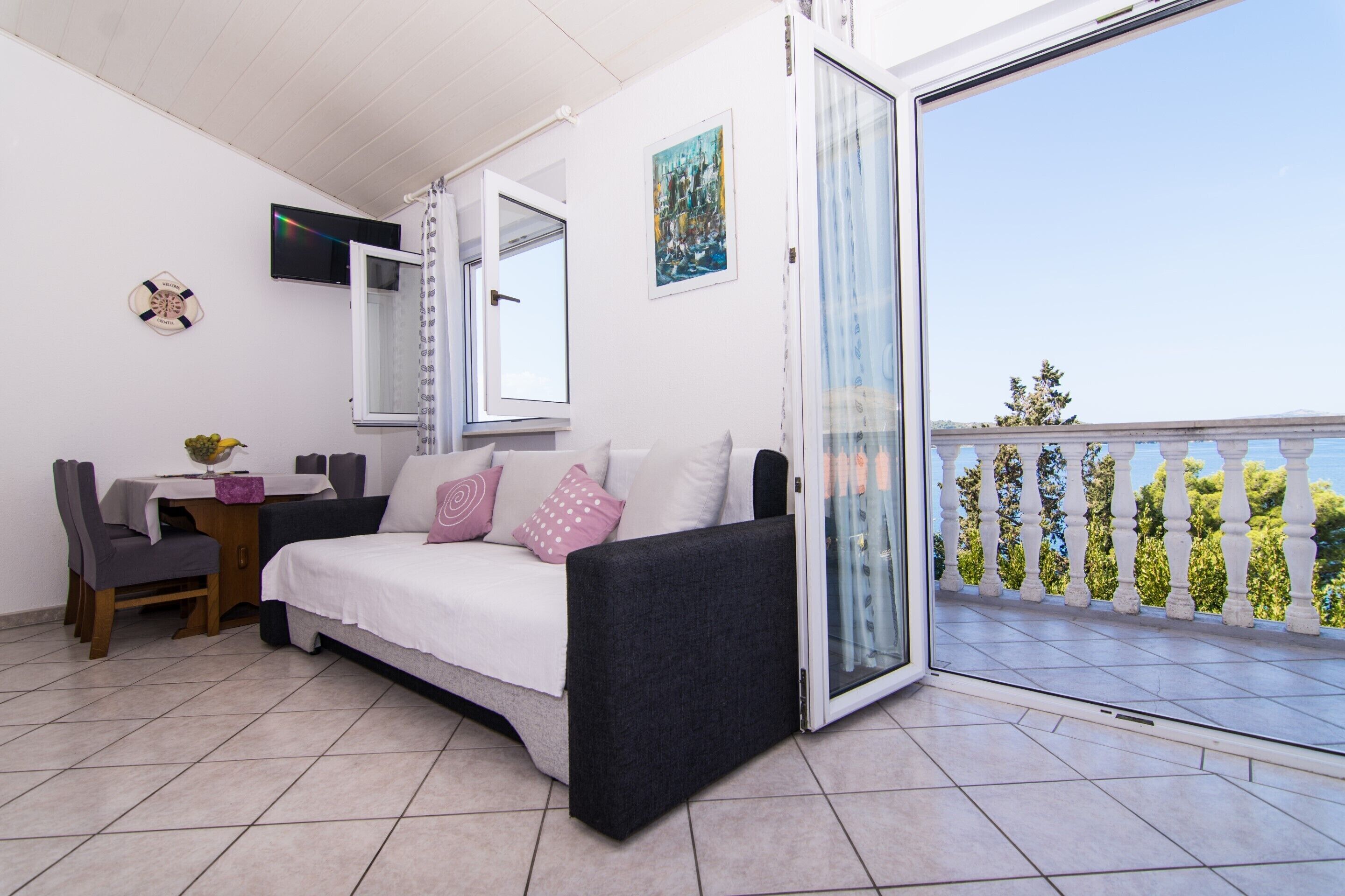 Comfort Apartment | Living area | 32-inch LCD TV with satellite channels, TV