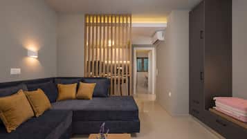 Luxury Apartment | Living area | 32-inch Smart TV with satellite channels