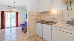 Fridge, coffee/tea maker, cookware/dishes/utensils