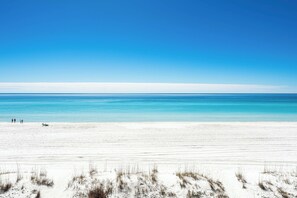 On the beach, sun-loungers, beach umbrellas, beach towels