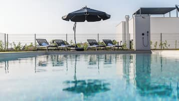 Seasonal outdoor pool, pool umbrellas, sun loungers