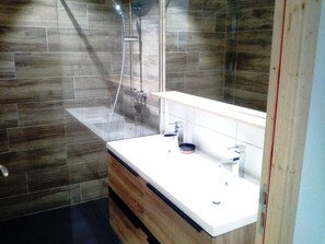 Bathtub, hair dryer, soap, toilet paper