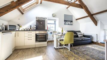 Apartment (1 Bedroom) | Living area | 32-inch flat-screen TV with digital channels, TV