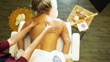 Experience a soothing massage in a serene spa setting, complete with a skilled therapist and a tranquil atmosphere.