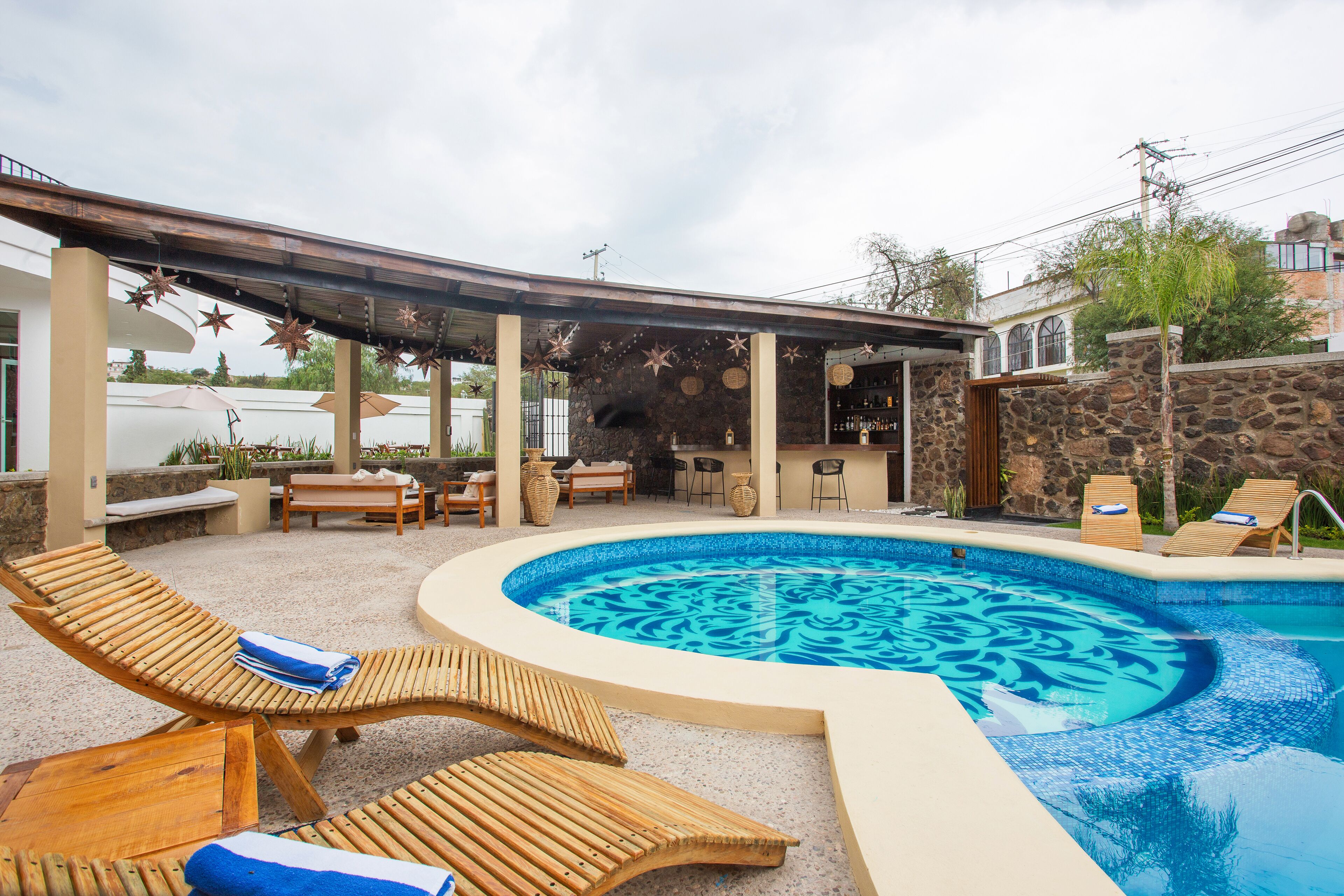 outdoor pool, open 9:00 am to 8:00 pm, pool umbrellas, pool loungers