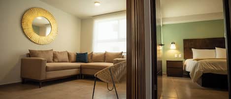 Family Single Room | Living area | 42-inch flat-screen TV with cable channels, TV