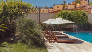 Outdoor pool, open 8:00 AM to 10:00 PM, sun loungers