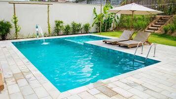 Outdoor pool, open 8:00 AM to 10:00 PM, sun loungers