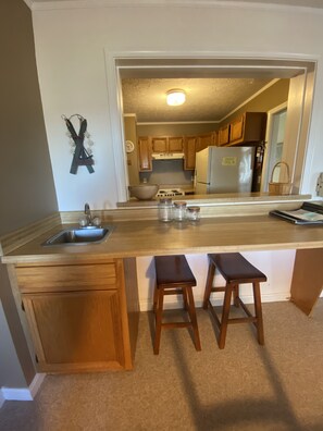 Microwave, coffee/tea maker, toaster, cookware/dishes/utensils