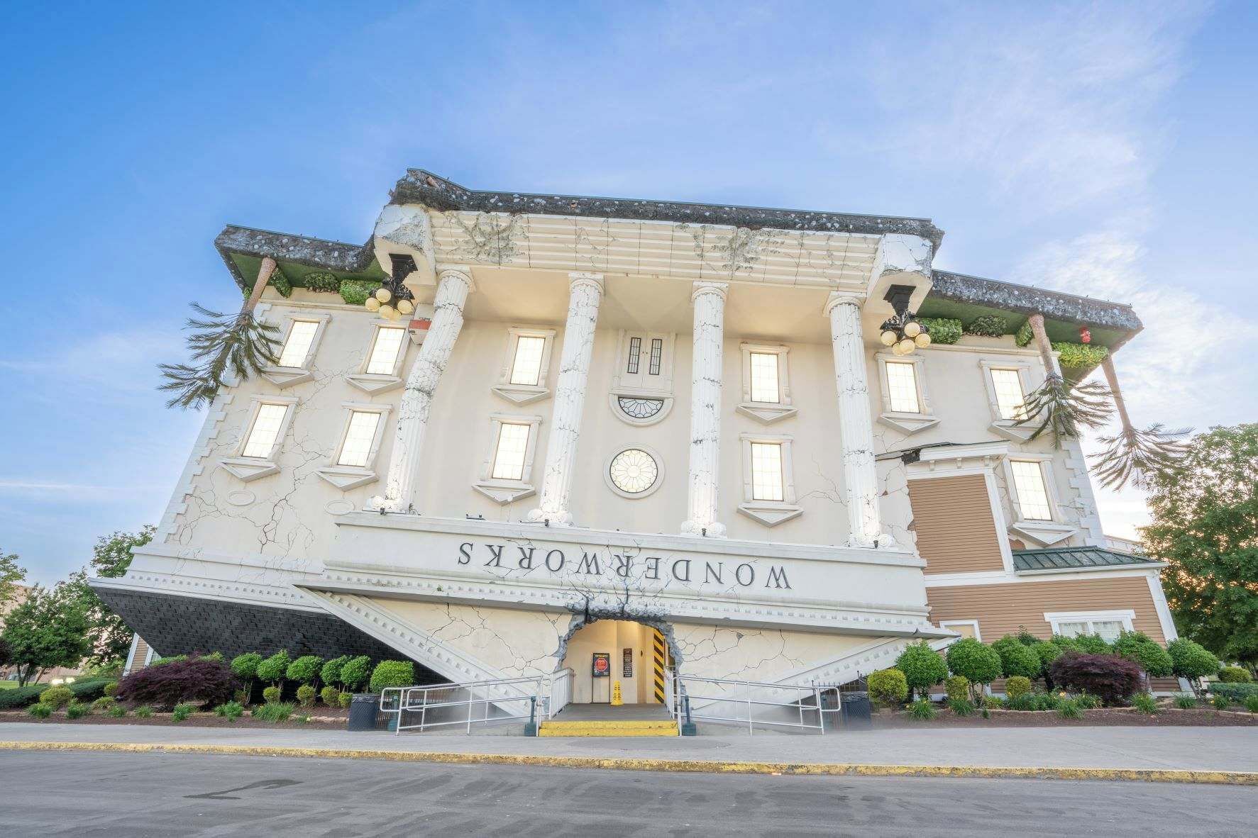 A building with classical architecture, featuring columns and a central entrance.