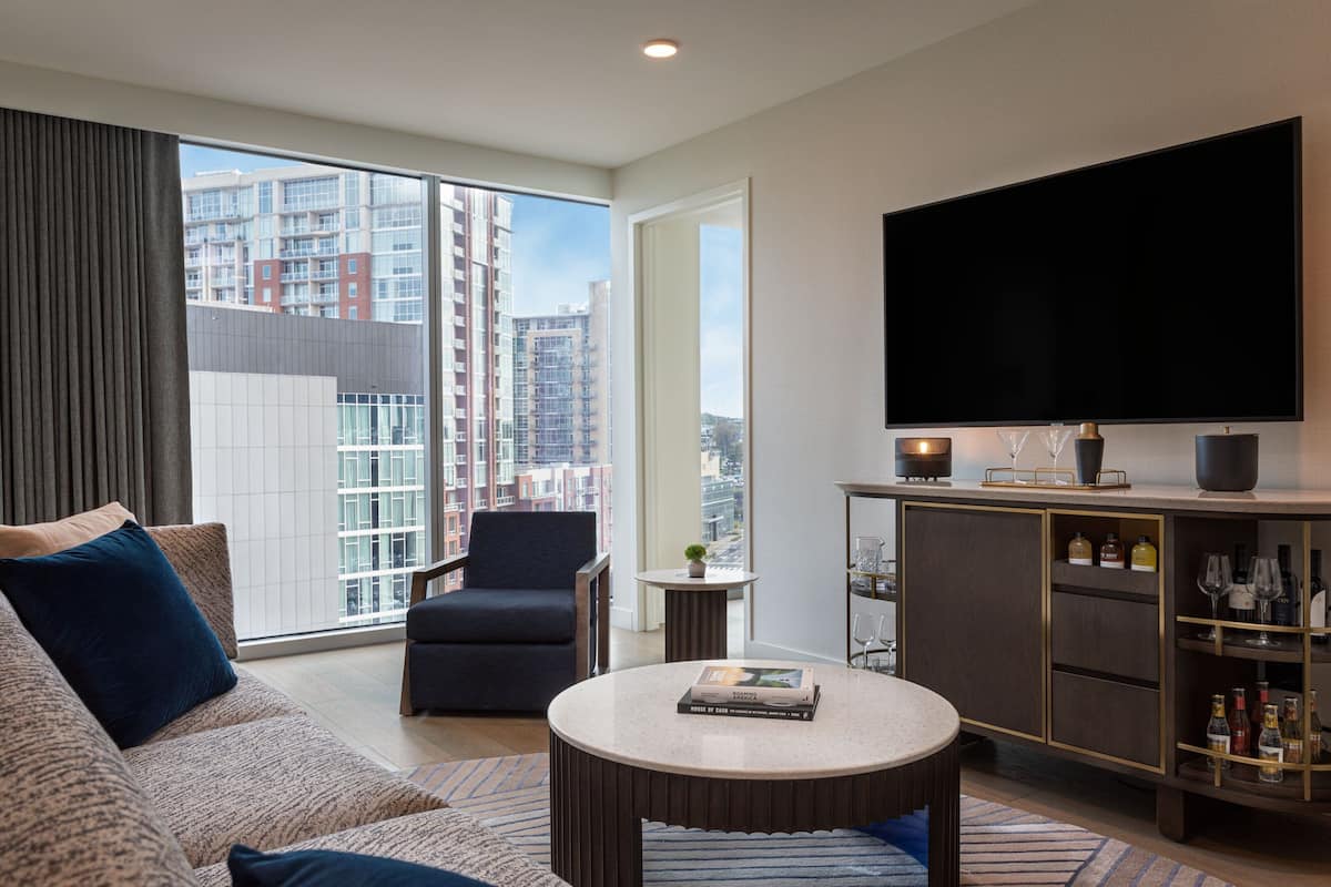 Premier Suite, 1 Bedroom, City View | Living room | 65-inch flat-screen TV with cable channels, TV