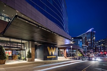 Experience the sleek, contemporary design of this urban hotel, featuring a prominent entrance and modern architecture. at W Nashville