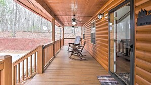 A wooden cabin with a porch, rocking chairs, and a sign reading "WATTER". - Cozy Hayesville Retreat w/ Deck & Mtn Views! (Hayesville)