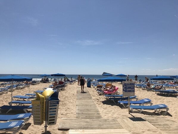 On the beach, sun loungers